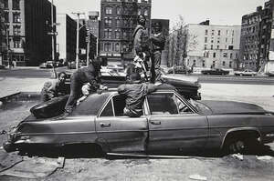 
	
		Eli Reed, 
		American b.1948-
		 
		Kids on the Car, A Long Walk Home, 2017;
		 
		