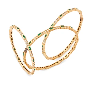 Three emerald and diamond set bangles, each designed as pairs of channel-set square step-cut...