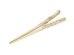 
	
		A pair of Continental ivory glove stretchers, late 19th century, the handles modelled in...