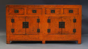 
	
		A Korean stained elm side cabinet, early 20th Century, the rectangular top above four...