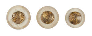 
	
		Three Japanese Ivory manju Netsuke, Meiji period, finished with abstract metal designs,...