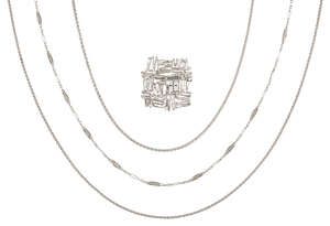 
	
		A diamond-set brooch and three neckchains, comprising: the openwork abstract design...