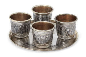 
	
		A Russian silver niello coaster with four Russian silver niello beakers, all post 1958,...