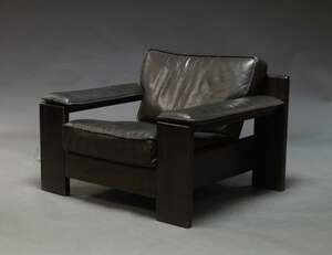 
	
		Harry de Groot for Leolux, a leather upholstered armchair, c.1970s, on stained wood...