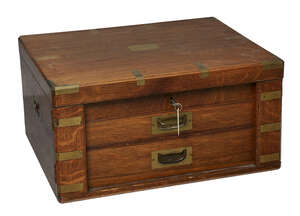 
	
		An oak and brass bound canteen box, early 20th century, with blue felt lining, the...