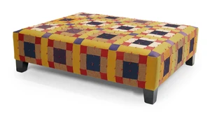 A large modern ottoman upholstered in an American patchwork quilt, 42cm high, 149cm wide, 118cm deep
Provenance: Supplied and upholstered by Sibyl Colefax & Jo