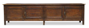 
	
		A Chinese elm low cabinet, early 20th century, the rectangular top above two pairs of...