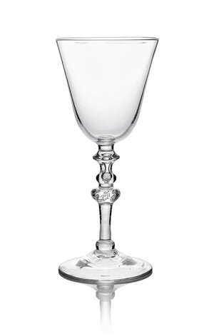 A large George II Newcastle goblet, C. 1740, the bell bowl above angular knop, with teared baluster knop, teared inverted baluster knop and beaded inverted bal