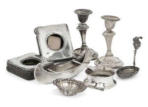 
	
		A group of silver items comprising: a silver model of a canoe, Birmingham, c.1898,...
