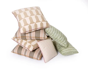 A group of seven cushions by Robert Kime Ltd., comprising: a pair of modern green cotton Ikat...