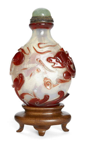 
	
		A Chinese ruby red-overlay 'dragons' snuff bottle, 19th century, the translucent...