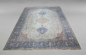 
	
		A Kashan carpet, mid 20th Century, with pole medallion in deep blue floral and foliate...