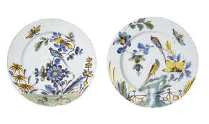 
	
		A pair of delft plates, Liverpool, 18th century, each decorated with panels of flowers...