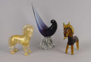 An Italian art glass model of a horse, attributed to the Seguso Vetri d' Arte factory, 20th century, modelled in clear glass with flecking of adventurine, 
