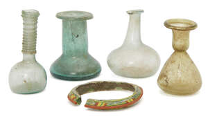 Four small Roman glass vessels, circa 2nd-4th century AD., including a pale blue spherical-bodied unguentarium, trailing applied to the tall cylindrical neck, 