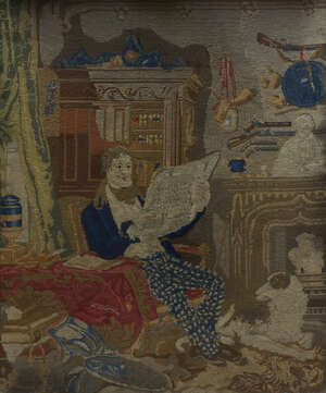 
	
		A Victorian needlework of a man reading a newspaper in an interior, within an elaborate...