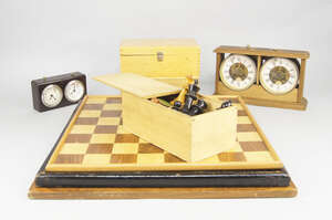 
	
		Three wood and ebonised wood chess sets, in wooden cases, together with three boards and...