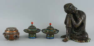 
	
		A pair of Tibetan enamel and metal cup stands and lids, 20th century, the bases 12.4cm...