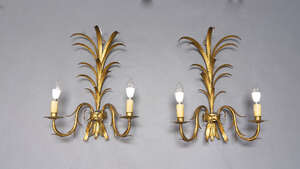 
	
		A pair of gilt metal twin branch wall lights, 20th century, with palm leaf backplates...