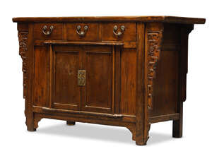 
	
		A Chinese elm side cabinet, late 19th century, the rectangular top above three frieze...