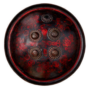 
	
		A lacquered rhino hide shield with figurative decoration, Rajasthan, India, late 18th...