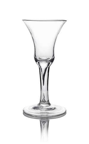 A large George II wine glass, c. 1740, the bell bowl above a teared stem, on folded foot, 21.5cm high
		 
		 
