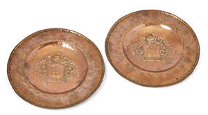 
	
		A pair of Italian copper chargers, 18th/19th century, each repousse decorated and centred...