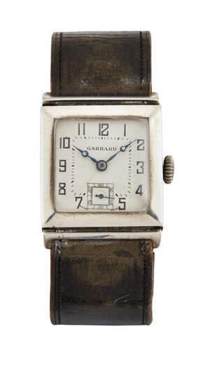 
	
		An Art Deco silver wristwatch, retailed by Garrard, the square off-white dial with Arabic...