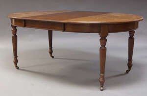 
	
		An Edwardian mahogany wind out dining table, with d-ends and two additional leaves,...