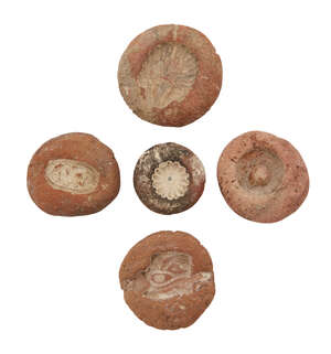 Five Egyptian terracotta bead and ring moulds, Amarna Period, 14th century BC., largest 3.7cm. diam. (5)
		Provenance: Private UK collection acquired by the v