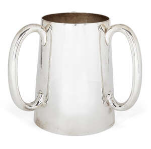 A large Arts & Crafts period three-handled silver tankard (tyg), London, c.1892, Wakely & Wheeler, the tapering cylindrical body with hammered finish to three 