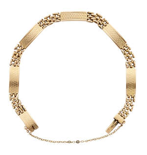 
	
		A bracelet, composed of engraved curved rectangular panels with flexible brick link...