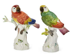 
	
		Two Meissen porcelain models of red and green parrots, both c.1949-1953, blue crossed...