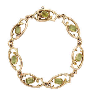 
	
		An Edwardian gold, peridot bracelet, composed of rectangular-cut peridot and oval...