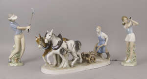 A Sitzendorf porcelain figure group of a ploughman, 20th century, printed marks to base, 37cm wide, together with a pair of Dao porcelain figures of golfers (3