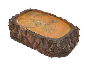 
	
		An unusual oak vide poche, early 20th century, carved with fairies in a woodland setting,...