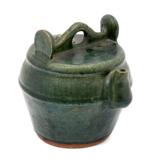 A Chinese provincial earthenware kettle, late 19th century, with allover dark green glaze, 19cm...