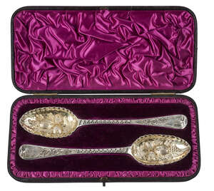 A pair of George III spoons, London c.1790, Hester Batemen, later embossed to berry spoons, in Victorian fitted case