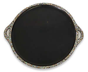 
	
		A Japanese lacquered wood circular tray, early 20th century, the raised rim inlaid with...