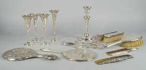 
	
		A miscellaneous collection of silver, to include four bud vases, (weighted) candlestick,...