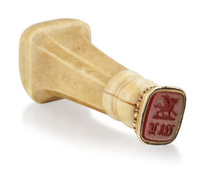 An early 19th century gold cased bone and ivory desk seal, the rounded rectangular cornelian...