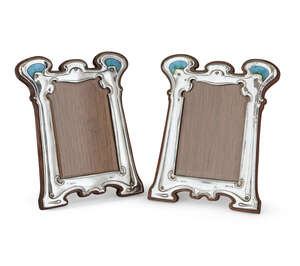 
	
		William Hutton & Sons, a pair of Art Nouveau silver and enamel photograph frames
		Mark...