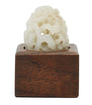 
	
		A Chinese pale green jade Yuan style finial, early 20th century, carved with leafy...
