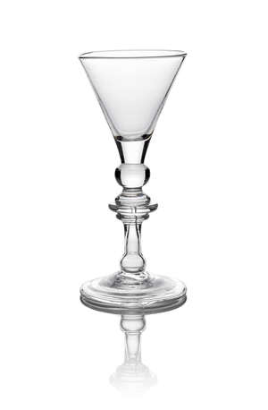 A George I baluster wine glass, c. 1725,with  trumpet bowl, above ball knop and triple annulated knop, with teared hollow baluster knop, on folded conical foot