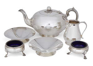 
	
		A Victorian silver teapot with wooden stand, London, c.1851, Edward, John & William...