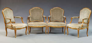
	
		A set of four Louis XV style beech fauteuils, early 20th Century,  upholstered in green...