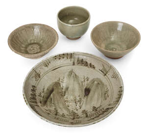 
	
		Three Thai Sawankhalok bowls, 15th-16th century, each covered in a celadon glaze, two...