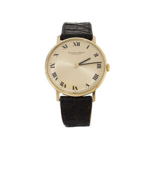 
	
		A wristwatch by International Watch Co, the circular gilt dial with black enamel Roman...