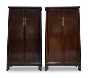 
	
		A pair of Ming style stained hardwood cupboards, late 20th century, of tapering form,...