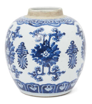 A Chinese porcelain ginger jar, Kangxi period, painted in underglaze blue with lotus blooms and shou characters beneath a ruyi border, underglaze blue double r